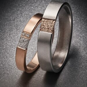 Alliances “Carré d’Origine” en or rose et or gris